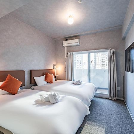 Apartment Hotel 11 Umeda Osaka Bagian luar foto