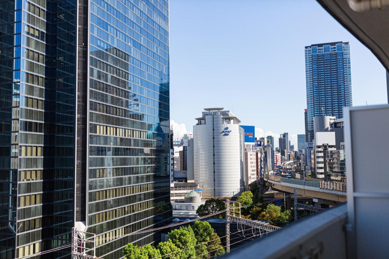 Apartment Hotel 11 Umeda Osaka Bagian luar foto
