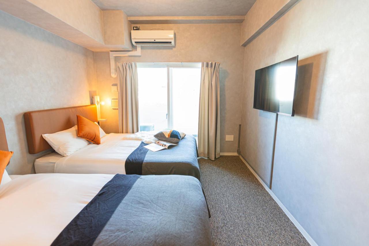 Apartment Hotel 11 Umeda Osaka Bagian luar foto