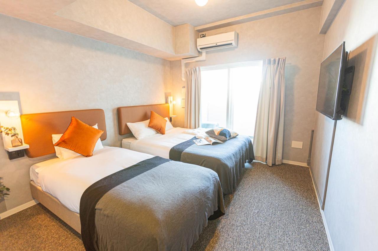 Apartment Hotel 11 Umeda Osaka Bagian luar foto