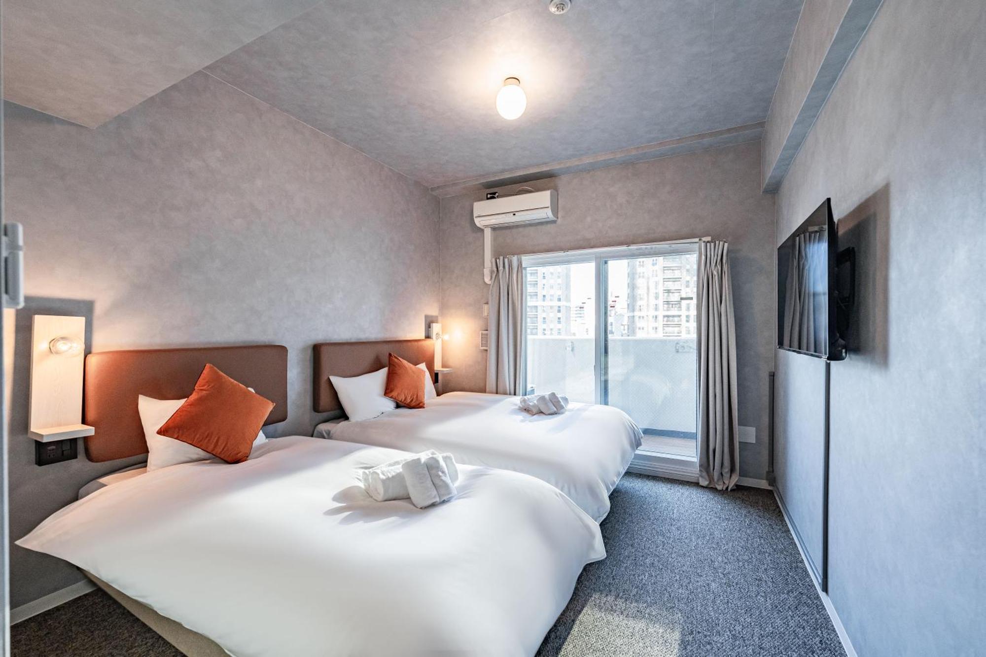 Apartment Hotel 11 Umeda Osaka Bagian luar foto